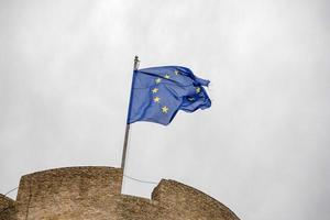 eu flag waving on castel sant angelo rome photo