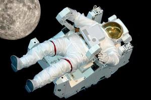 Astronaut isolated while floating on black photo