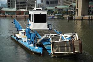 garbage plastic rubbish water sea cleaner boat photo