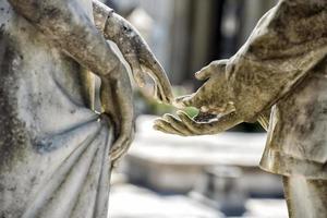 young lovers while smiling marble statue photo