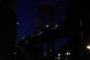 empire state building new york city night view from dumbo photo