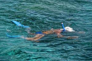 A snorkelist in Siladen turquoise tropical paradise island photo