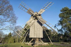 wooden windmill in summer photo