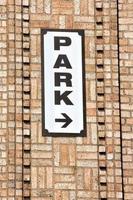 park sign on brick wall photo