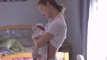 beautiful young mom with newborn baby video