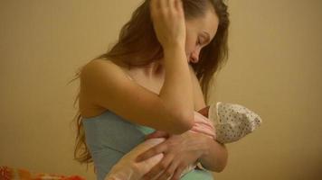 beautiful young mom with newborn baby video