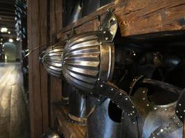 many medieval iron metal helm armor photo