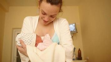 beautiful young mom with newborn baby video