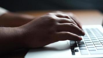 hand typing on laptop on office desk video