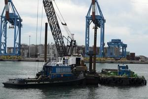 Harbor port dredge working on sea photo