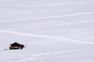 dolomites snow panorama big landscape hut covered by snow photo