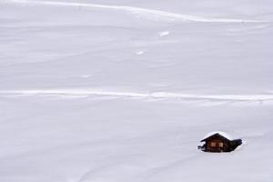 dolomites snow panorama big landscape hut covered by snow photo