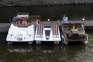 PRAGUE, CZECH REPUBLIC - JULY 15 2019 - Old style cars boats in Town is full of tourist in summer time photo