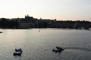 PRAGUE, CZECH REPUBLIC - JULY 15 2019 - Old style cars boats in Town is full of tourist in summer time photo