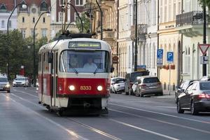 PRAGUE, CZECH REPUBLIC - JULY 15 2019 - Typical red tram of Town full of tourist in summer time photo