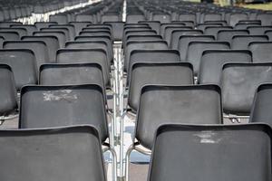 Many empty chairs without audience photo