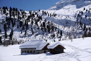 dolomites snow panorama big landscape hut covered by snow photo