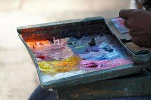 Man painting with hand photo