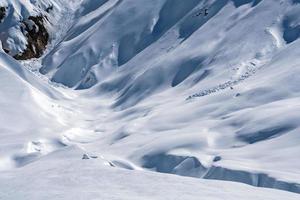 Avalanche snow slide in dolomites mountains photo