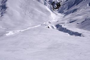 Avalanche snow slide in dolomites mountains photo