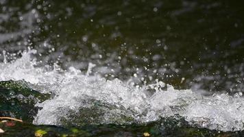 Top of the mighty river waterfall in slow motion video