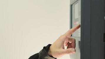 Setting the house alarm system. Close-up of a man pressing the password to arm the house video