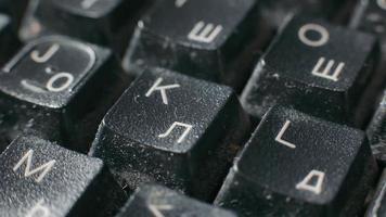 Close-up of an old keyboard in a dilapidated state. Dirty keyboard with Latin and Cyrillic letters. video