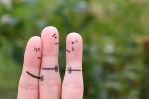 Fingers art of happy couple. A man loves another woman. The concept of unrequited love. photo