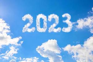 2023 year written on a blue sky of clouds. Concept of happy New year. photo