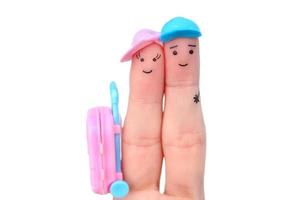 Fingers art of happy couple. Man and woman going on vacation  isolated on white. photo