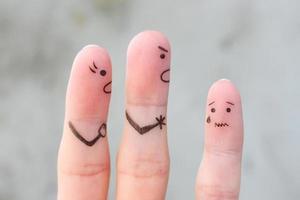 Finger art of family during quarrel. The concept of parents scolded her daughter, she was crying. photo