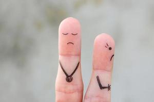 Fingers art of wife leaves a husband. The concept of divorce. photo