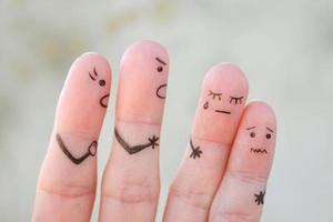 Fingers art of family during quarrel. The concept of parents scolded children, they were crying. photo