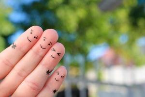 Fingers art of happy family.  The concept of a walk in the autumn park. photo