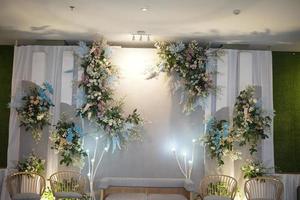 Beautiful Wedding Decoration with Flowers, Leaves and Lamps photo