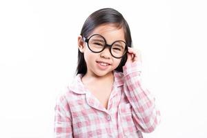 little girl asian wearing glasses, pink shirt, white background photo