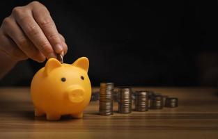 money save concept, businessman keeping money in a piggy bank. financial planning, save money for the future, Savings and pensions,  finance, investment, Financial planning. photo