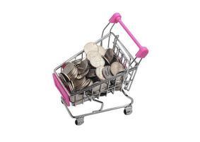 Shopping cart with coins on white background.Isolated photo