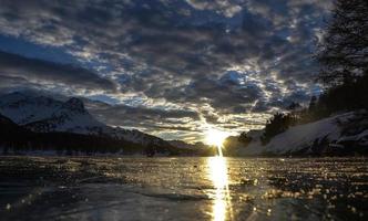 Frozen lake sunset photo
