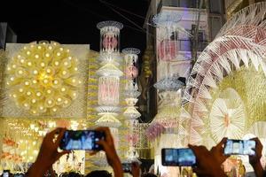 2nd October 2022, Kolkata, West Bengal, India. Visitor take the snap of Mudiali Durga Puja Pandal Decoration photo