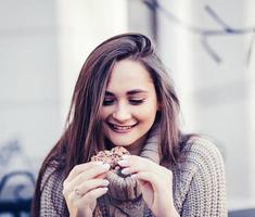 woman eating cookie photo