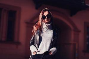 Fashion woman in leather jacket photo