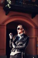 Glamorous woman in leather jacket photo