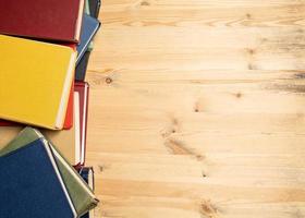 Various books on a wooden table. Flatley. Education concept. Copy space. photo