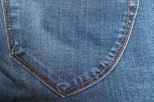 Back jeans pocket. Copy space. Flatley. Textured background. Sale concept. photo