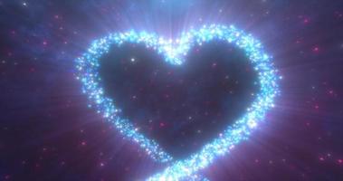 Glowing blue love heart made of particles on a blue festive background for Valentine's Day photo