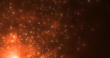 Abstract orange fiery flame bonfire of particles and sparks glowing beautiful magical on a dark background. Abstract background photo