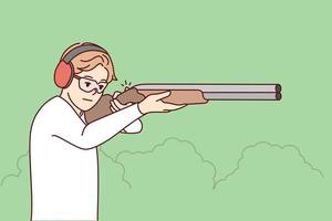 Man in headphones and glasses shoot with rifle in shooting gallery. Guy with weapon in hands hunting in park. Vector illustration.