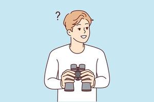 Smiling young man feeling confused holding binoculars in hands. Happy male frustrated looking in binocular finding solution. Exploration and discovery. vector