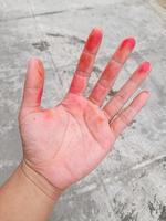 Asian hands stained with printer ink photo